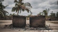 (FILES) In this file photo taken on August 24, 2019 a destroyed house is seen in the recently attacked village of Aldeia da Paz outside Macomia. - For more than two years, a mysterious group of Islamist inspiration, without a face and without claims, has been spreading death and terror in the far north of Mozambique, where the majority of people are Muslim. But in recent months, the nature of the conflict seems to have changed. The Mozambican army has taken the lead in policing operations in Cabo Delgado province, with the discreet support of Russian mercenaries. And the Islamic State group emerged by claiming its first attacks. (Photo by MARCO LONGARI / AFP)