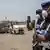 A cargo of supplies to fight COVID-19 under guard on a runway in Dakar, Senegal