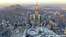 An aerial view shows the Grand Mosque and the Mecca Tower, deserted on the first day of the Muslim fasting month of Ramadan, in the Saudi holy city of Mecca, on April 24, 2020, during the novel coronavirus pandemic crisis. (Photo by BANDAR ALDANDANI / AFP)