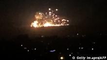 An image grab shows on November 20, 2019 smoke and fire billowing during a reported Israeli air strike on the outskirts of Damascus. - The Israeli army confirmed that it carried out strikes against military sites in Damascus today, in response to rocket fire from Syria the previous day. We just carried out wide-scale strikes of Iranian Quds Force & Syrian Armed Forces targets in Syria in response to the rockets fired at Israel by an Iranian force in Syria, the Israel Defense Forces tweeted. Syria's state media earlier said Syrian anti-aircraft defences intercepted a heavy attack by Israeli warplanes over the capital Damascus. (Photo by - / AFP) (Photo by -/AFP via Getty Images)