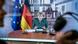 Merkel appearing on a computer screen Merkel appearing on a computer screen