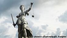Justitia symbol of justice in front of background with sky and clouds. Concept of justice and law. | Verwendung weltweit