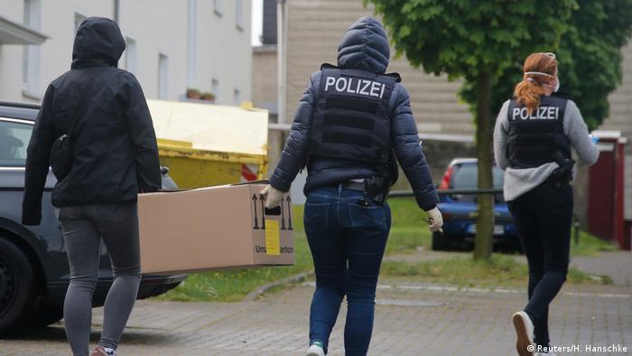  German special police carry a box from the premises of the Gemeinschaft libanesischer Emigranten e.V. (community of Lebanese emigrants) in Dortmund