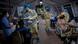 Medical personnel wearing protective clothing work to treat patients Medical personnel wearing protective clothing work to treat patients