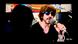 A woman watches Bollywood actor Shah Rukh Khan siging during the 'I For India' concert live on Facebook on a television screen in New Delhi on May 3, 2020 A woman watches Bollywood actor Shah Rukh Khan siging during the 'I For India' concert live on Facebook on a television screen in New Delhi on May 3, 2020
