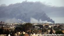 Smoke fumes rise above buildings in the Libyan capital Tripoli, during reported shelling by strongman Khalifa Haftar's forces, on May 9, 2020 (Photo by Mahmud TURKIA / AFP) (Photo by MAHMUD TURKIA/AFP via Getty Images)