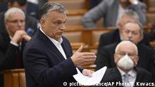 FILE - In this March 23, 2020***
, file photo, Hungarian Prime Minister Viktor Orban delivers his speech about the current state of the coronavirus outbreak during a plenary session in the House of Parliament in Budapest, Hungary. Prime Minister Orban may have been the most adroit at exploiting the health crisis. His country’s Parliament granted him the power to rule indefinitely by decree, unencumbered by existing laws or judicial or parliamentary restraints. One aspect of the law ostensibly passed to cope with the coronavirus calls for prison terms of up to five years for those convicted of spreading falsehoods or distorted facts during the emergency. (Tamas Kovacs/MTI via AP, File) |