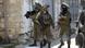 Israeli soldiers patrol after a soldier was killed when a rock thrown off a rooftop struck him in the head g during an arrest raid, in the village of Yabad near the West Bank city of Jenin, Israeli soldiers patrol after a soldier was killed when a rock thrown off a rooftop struck him in the head g during an arrest raid, in the village of Yabad near the West Bank city of Jenin,