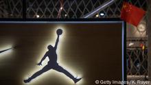 BEIJING, CHINA - OCTOBER 09: A China flag is seen placed on a display at the NBA flagship retail store on October 9, 2019 in Beijing, China. The NBA is trying to salvage its brand in China amid criticism of its handling of a controversial tweet that infuriated the government and has jeopardized the leagues Chinese expansion. The crisis, triggered by a Houston Rockets executives tweet that praised protests in Hong Kong, prompted the Chinese Basketball Association to suspend its partnership with the league. The backlash continued with state-owned television CCTV scrapping its plans to broadcast pre-season games in Shanghai and Shenzhen, and the cancellation of other promotional fan events. The league issued an apology, though NBA Commissioner Adam Silver angered Chinese officials further when he defended the right of players and team executives to free speech. China represents a lucrative market for the NBA, which stands to lose millions of dollars in revenue and threatens to alienate Chinese fans. Many have taken to Chinas social media platforms to express their outrage and disappointment that the NBA would question the countrys sovereignty over Hong Kong which has been mired in anti-government protests since June.(Photo by Kevin Frayer/Getty Images)