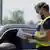 A German border police officers checks the documentation of a driver at a checkpoint