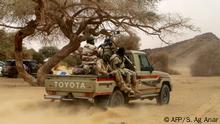 February 12, 2020***
Niger soldiers patrol in the desert of Iferouane on February 12, 2020 to protect tourists and dignitaries during the Air Festival. (Photo by Souleymane Ag Anara / AFP)