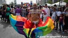A reveler takes part in the 19th Gay Pride Parade at downtown Caracas on June 30, 2019. (Photo by Federico PARRA / AFP) (Photo credit should read FEDERICO PARRA/AFP via Getty Images)