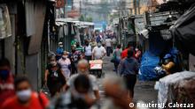 People walk on a street near the city Central Market during a nationwide quarantine to prevent the spread of the coronavirus disease (COVID-19), in San Salvador, El Salvador May 6, 2020. REUTERS/Jose Cabezas