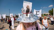 STUTTGART, GERMANY - MAY 16: Demonstrators gather to protest against lockdown measures and other government policies relating to the novel coronavirus crisis on May 16, 2020 in Stuttgart, Germany. Thousands of protesters from a wide spectrum of political creeds, from far left to far right, from the simply disgruntled to conspiracy enthusiasts, gathered in cities nationwide to protest against government policies and measures many decry as disproportionate and undemocratic. Germany has been easing lockdown measures over recent weeks in an ongoing process. (Photo by Thomas Lohnes/Getty Images)