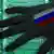 Рука с российским флагом на фоне материнской платы компьютера