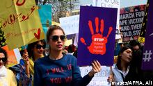 Activists of the Aurat (Woman) March hold placards as they march during a rally to mark International Women's Day in Lahore on March 8, 202 - Demonstrators were gathering for rallies across Pakistan on March 8 to mark International Women's Day in an ultra-conservative society where women are still put to death under ancient honour codes. (Photo by ARIF ALI / AFP) (Photo by ARIF ALI/AFP via Getty Images)
