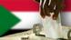 Ballot box with flag of Sudan in the background Ballot box with flag of Sudan in the background
