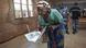 A woman carries her ballot papers during Burundi's election A woman carries her ballot papers during Burundi's election