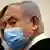 Israeli Prime Minister Benjamin Netanyahu, wearing a face mask,