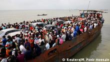 Migrant people are seen on board of an overcrowded ferry, as they go home to celebrate Eid al-Fitr, amid concerns over the coronavirus disease (COVID-19) outbreak, in Munshiganj, Bangladesh, May 23, 2020. REUTERS/Mohammad Ponir Hossain