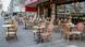 Empty chairs and tables outside a café in Berlin Empty chairs and tables outside a café in Berlin