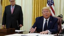 President Donald Trump speaks before signing an executive order aimed at curbing protections for social media giants, in the Oval Office of the White House, Thursday, May 28, 2020, in Washington. Attorney General William Barr watches. (AP Photo/Evan Vucci) |