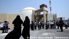 Iranian women security officials (foreground) and media at the opening of a nuclear plant in Bushehr, Iran in 2010