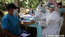29.05.2020
A health worker conducts a test for the coronavirus disease (COVID-19) with a man in the Bela Vista do Jaraqui, in the Conservation Unit Puranga Conquista along the Negro River banks, where Ribeirinhos (forest dwellers) live, amid the coronavirus disease (COVID-19) outbreak, in Manaus, Brazil, May 29, 2020. REUTERS/Bruno Kelly