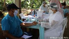 29.05.2020
A health worker conducts a test for the coronavirus disease (COVID-19) with a man in the Bela Vista do Jaraqui, in the Conservation Unit Puranga Conquista along the Negro River banks, where Ribeirinhos (forest dwellers) live, amid the coronavirus disease (COVID-19) outbreak, in Manaus, Brazil, May 29, 2020. REUTERS/Bruno Kelly