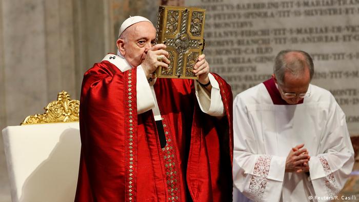 Pope Francis holds a giant bible