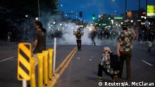 Protesters stay out past the state ordered curfew of 8 p.m. in protest against the death in Minneapolis police custody of George Floyd, in Denver, Colorado, U.S. May 31, 2020. REUTERS/Alyson McClaran