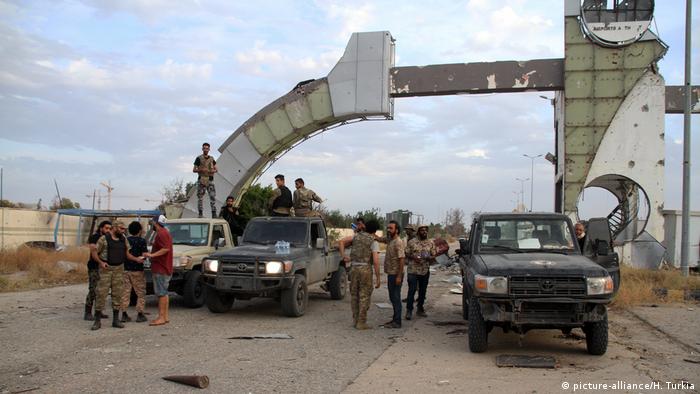 Fighters of Libya's UN-backed government are seen at an airport in the south of Tripoli,