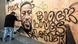 Artist AmendTDK paints a mural of George Floyd in Oakland, California Artist AmendTDK paints a mural of George Floyd in Oakland, California