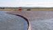 A containment boom holds back diesel fuel on the Ambarnaya River A containment boom holds back diesel fuel on the Ambarnaya River