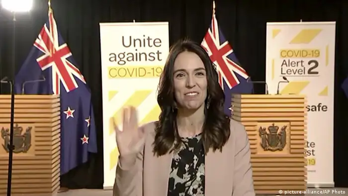 New Zealand's Prime Minister Jacinda Ardern smiles and waves at the camera