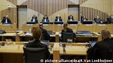 Presiding judge Hendrik Steenhuis, rear, fourth from left, opens the court session as the trial resumed at the high security court building at Schiphol Airport, near Amsterdam, Monday, June 8, 2020, for three Russians and a Ukrainian charged with crimes including murder for their alleged roles in the shooting down of Malaysia Airlines Flight MH17 over eastern Ukraine nearly six years ago. (AP Photo/Robin van Lonkhuijsen, POOL) |