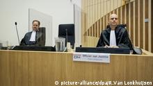 Public prosecutor Ward Ferdinandusse, right, waits for the trial to resume at the high security court building at Schiphol Airport, near Amsterdam, Monday, June 8, 2020, for three Russians and a Ukrainian charged with crimes including murder for their alleged roles in the shooting down of Malaysia Airlines Flight MH17 over eastern Ukraine nearly six years ago. (AP Photo/Robin van Lonkhuijsen, POOL) |
