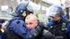 A supporter of the English Defence League is restrained by British police officers during a protest A supporter of the English Defence League is restrained by British police officers during a protest