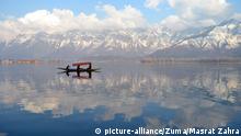 Feb 19, 2019 - Pulwama, Jammu And Kashmir, India - On a sunny day a boatman rows his boat in Dal lake, Srinagar, the summer capital of Indian controlled Kashmir, India |