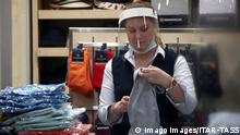 MOSCOW, RUSSIA - JUNE 3, 2020: A shop assistant with a face shield on at a Henderson clothing store. According to the Moscow mayor s decree, current face mask requirements apply not only to shoppers and public transport passengers, but to every citizen leaving their homes, from June 1. Valery Sharifulin/TASS PUBLICATIONxINxGERxAUTxONLY TS0DB464