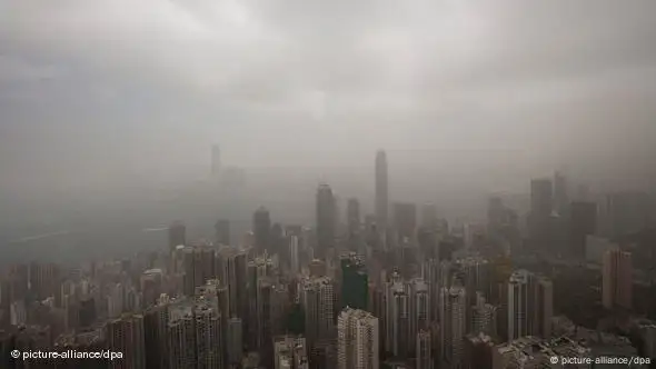 A blanket of smog descends on the Hong Kong skyline. Sandstorms from northern China are blamed.