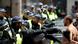 Police officers react ahead of a Black Lives Matter protest following the death of George Floyd in Minneapolis police custody, in London Police officers react ahead of a Black Lives Matter protest following the death of George Floyd in Minneapolis police custody, in London