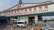 A police officer wearing a face mask is seen outside an entrance of the Xinfadi wholesale market, A police officer wearing a face mask is seen outside an entrance of the Xinfadi wholesale market,