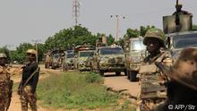 Nigerian soldiers patrol on October 12, 2019, after gunmen suspected of belonging to the Islamic State West Africa Province (ISWAP) group raided the village of Tungushe, killing a soldier and three residents. - Four civilians and three soldiers have been killed in attacks in northeastern Nigeria blamed on jihadist fighters, local residents and militias said on October 12, 2019. (Photo by - / AFP)