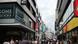 Cologne's central shopping street, filled with pedestrians Cologne's central shopping street, filled with pedestrians