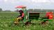 men on a tractor in a field men on a tractor in a field