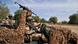 Soldiers sitting in a camouflaged vehicle in Mali Soldiers sitting in a camouflaged vehicle in Mali