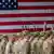 Американские солдаты на фоне флага США в Баварии (фото из архива)