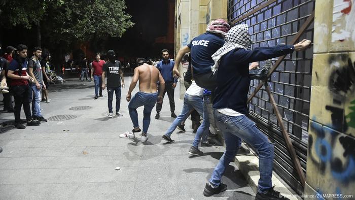 Protesters attack stores during a demonstration 