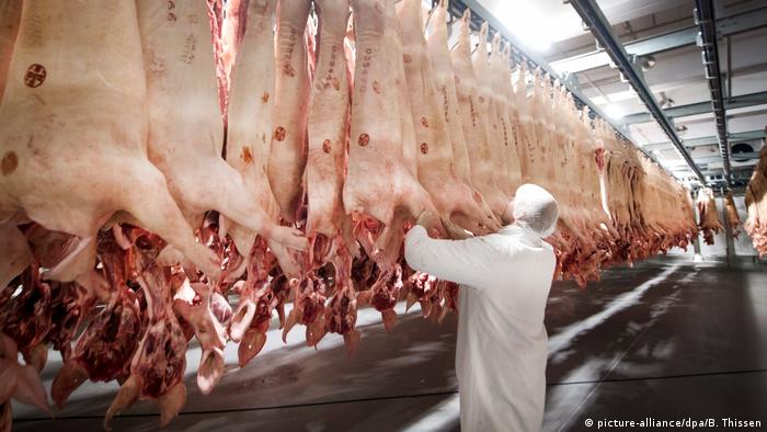 A coronavirus outbreak at a meat processing plant in Germany was caused in part to poor working conditions.